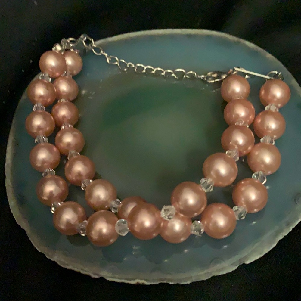 Faux pink pearls with rhinestone beads.